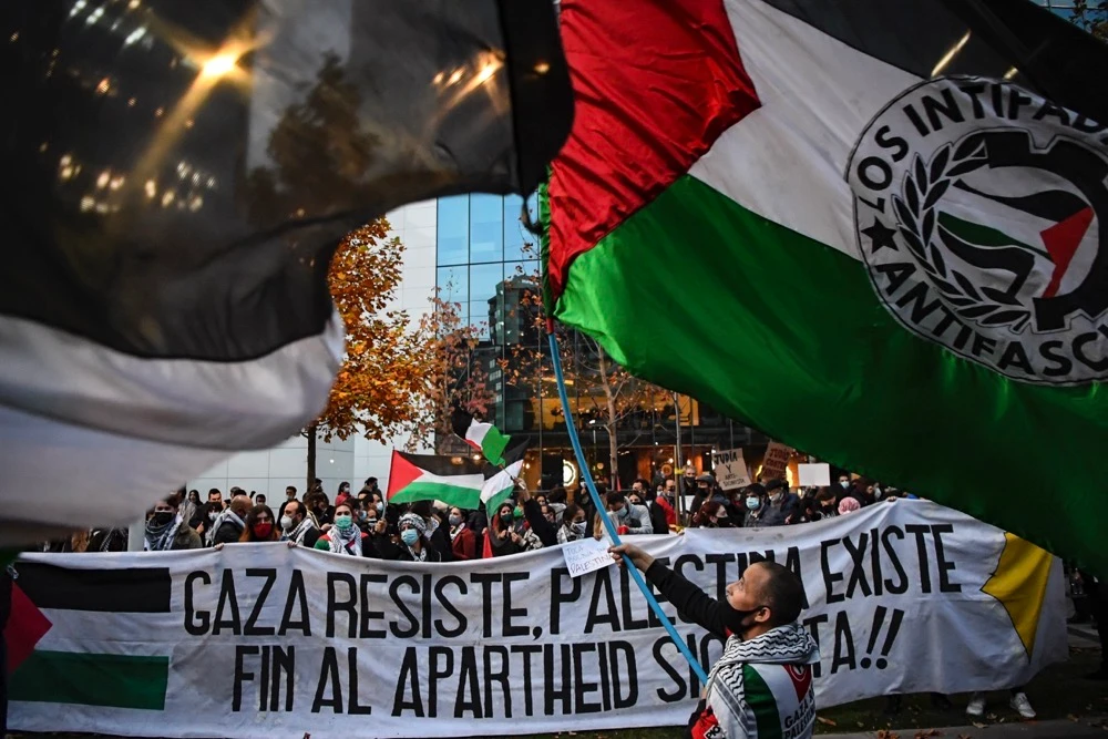 Sections of Chile’s 500,000-strong Palestinian diaspora rally outside the Israeli Embassy to call for an end to Gaza operations. The country’s newly elected president is building closer ties with Palestine. AFP take part in a protest outside the Israeli Embassy against Israel’s military operations in Gaza and in support of the Palestinian people, in Santiago on May 19, 2021. - Chile is the fourth largest destination for Palestinian communities and the first outside the Middle East. (AFP)