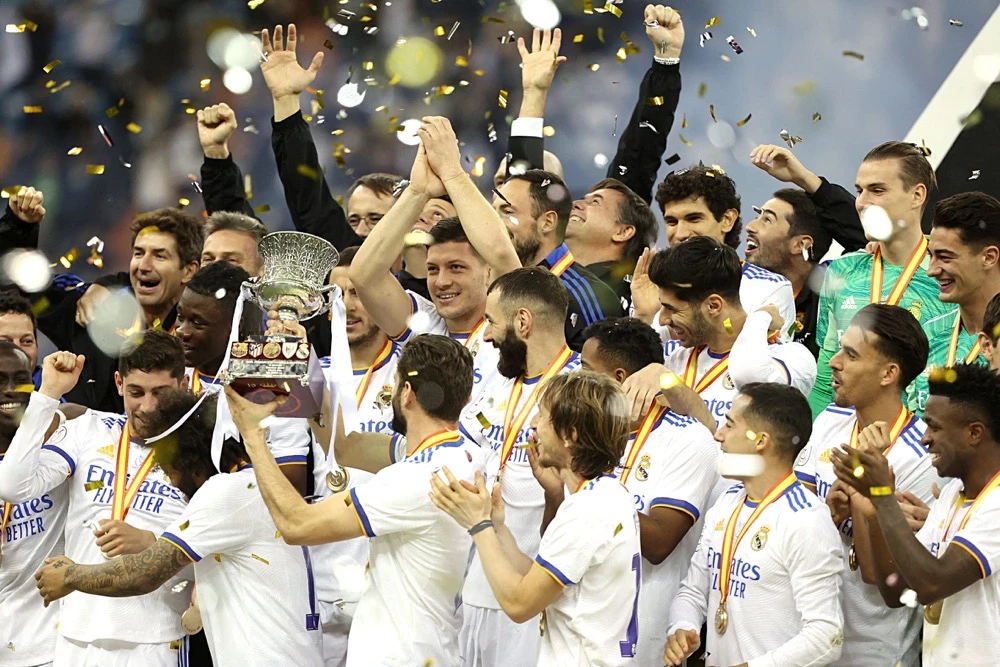 Real Madrid players celebrate after winning the Spanish Super Cup final football match against Athletic Bilbao on Jan. 16, 2022 at the King Fahad International Stadium in Riyadh. (File/AFP)