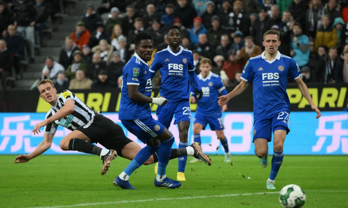 Newcastle United's English defender Dan Burn (L) scores the opening goal of the English League Cup quarterfinal between Newcastle United and Leicester City at St James' Park in Newcastle on Tuesday. (AFP)