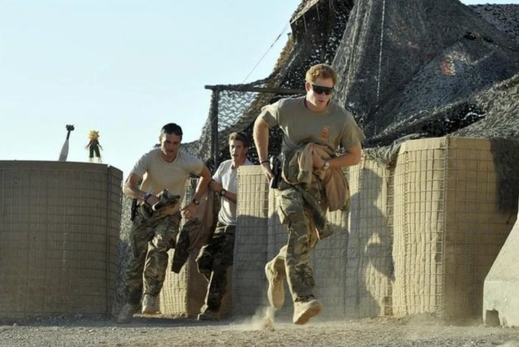 Prince Harry racing out from a VHR (very high readiness) tent with fellow crew members, to scramble his Apache helicopter at Camp Bastion, southern Afghanistan in 2012. (Reuters/File Photo)