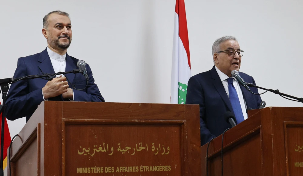 Lebanon's Foreign Minister Abdallah Bou Habib (R) and his Iranian counterpart Hossein Amir-Abdollahian hold a joint press conference at the Foreign Ministry in the Lebanese capital Beirut, on January 13, 2023. (AFP)