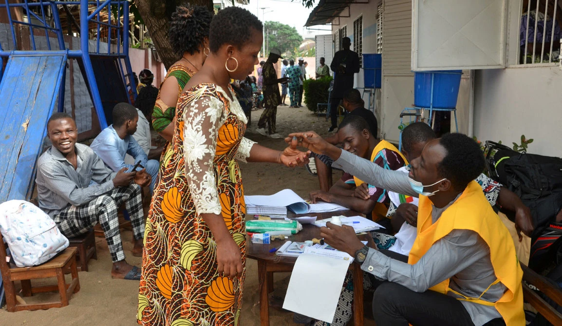 A resident prepares to cast her vote during the election in Benin. Reuters