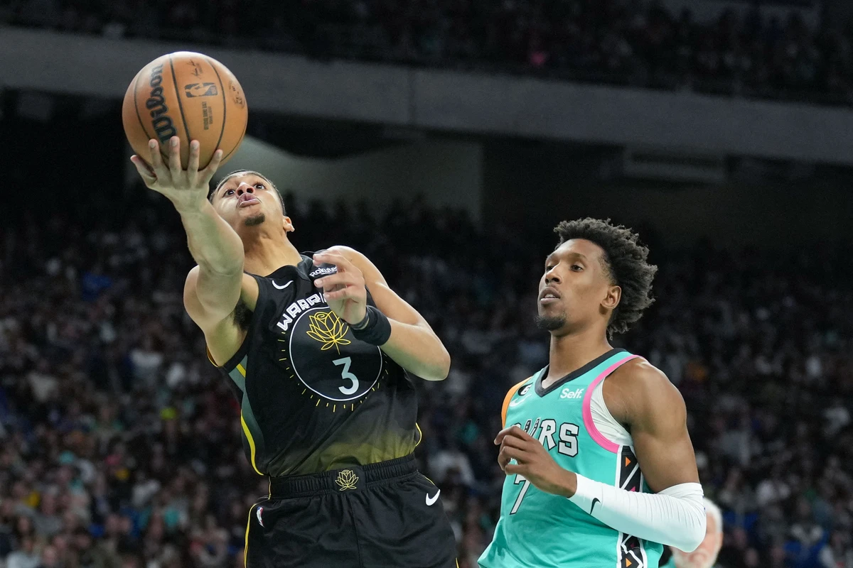 Golden State Warriors guard Jordan Poole shoots in front of San Antonio Spurs guard Josh Richardson in the second half of their NBA game at the Alamodome on Friday. (USA TODAY Sports)