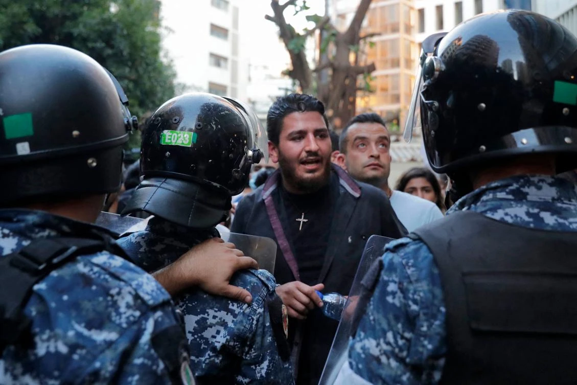 This file photo take on July 13, 2021 shows Lebanese activist William Noun (C), whose brother was killed in the massive port explosion in Beirut in August 2020, during a demonstration outside the residence of the minister of interior in the Lebanese capital against the authorities' lack of action to achieve justice for the victims of the bombing. (AFP)