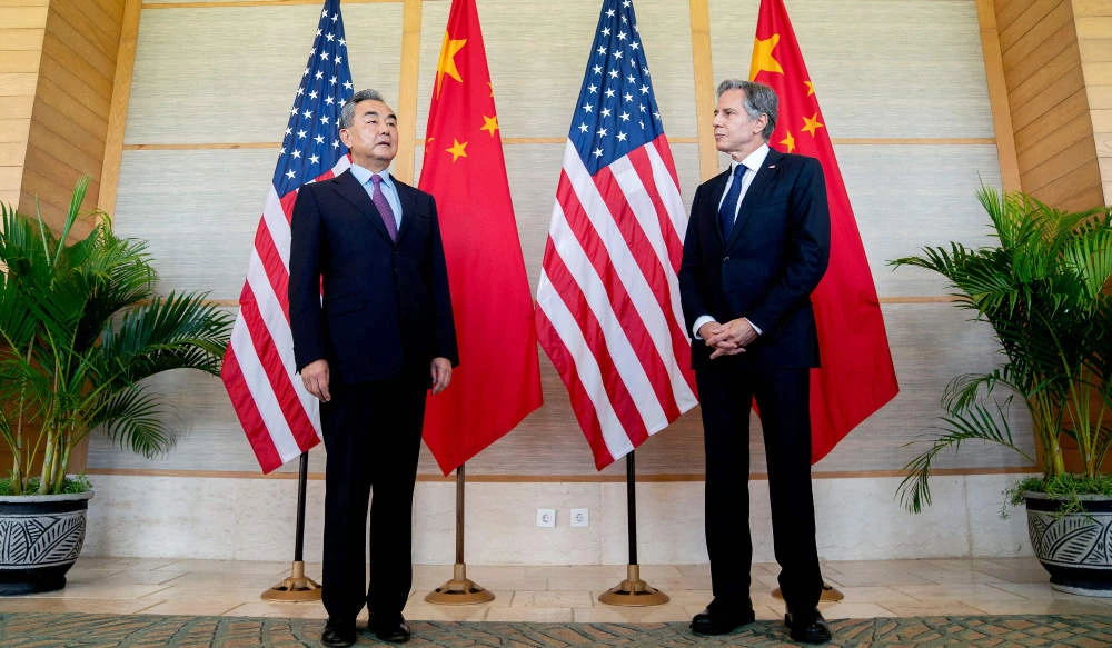 In this file photo taken on July 8, 2022, US Secretary of State Antony Blinken (R) and China's Foreign Minister Wang Yi attend a meeting in Nusa Dua on the Indonesian resort island of Bali. (AFP)