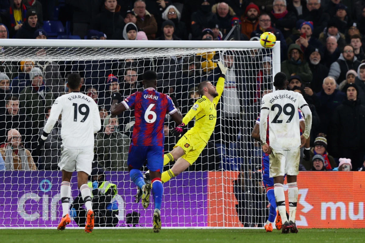 Crystal Palace's French midfielder Michael Olise (unseen) scores his team's first goal past Manchester United's during their English Premier League match on January 18, 2023. (AFP)