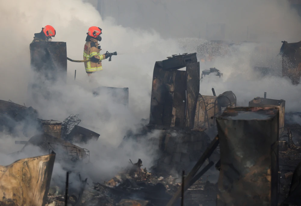 More than 800 fire fighters, police officers and public workers were deployed to fight the flame and handle evacuations after the fire broke out around 6:30 a.m. (Reuters)