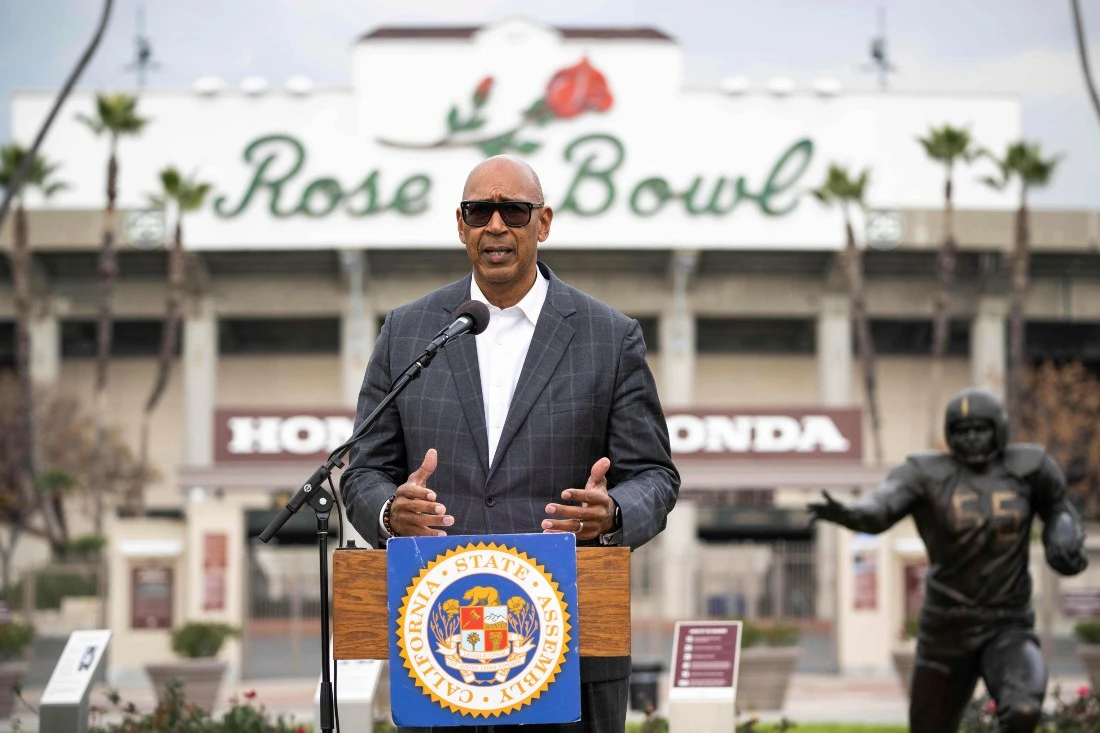 Assemblyman Chris Holden announces the College Athlete Protections Bill during a news conference at the Rose Bowl in Pasadena on Thursday. (The Orange County Register via AP)