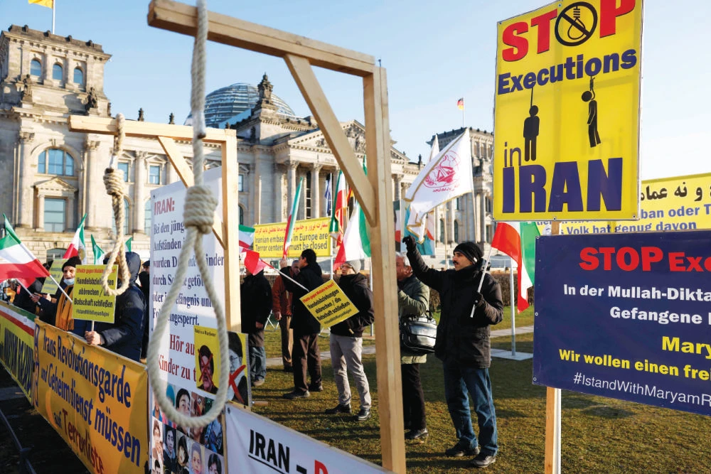 Activists of the Exile-Iranian Society stage a demonstration in Berlin, calling on Germany and the EU to blacklist Tehran’s Revolutionary Guards or IRGC as a terrorist group. (AFP)