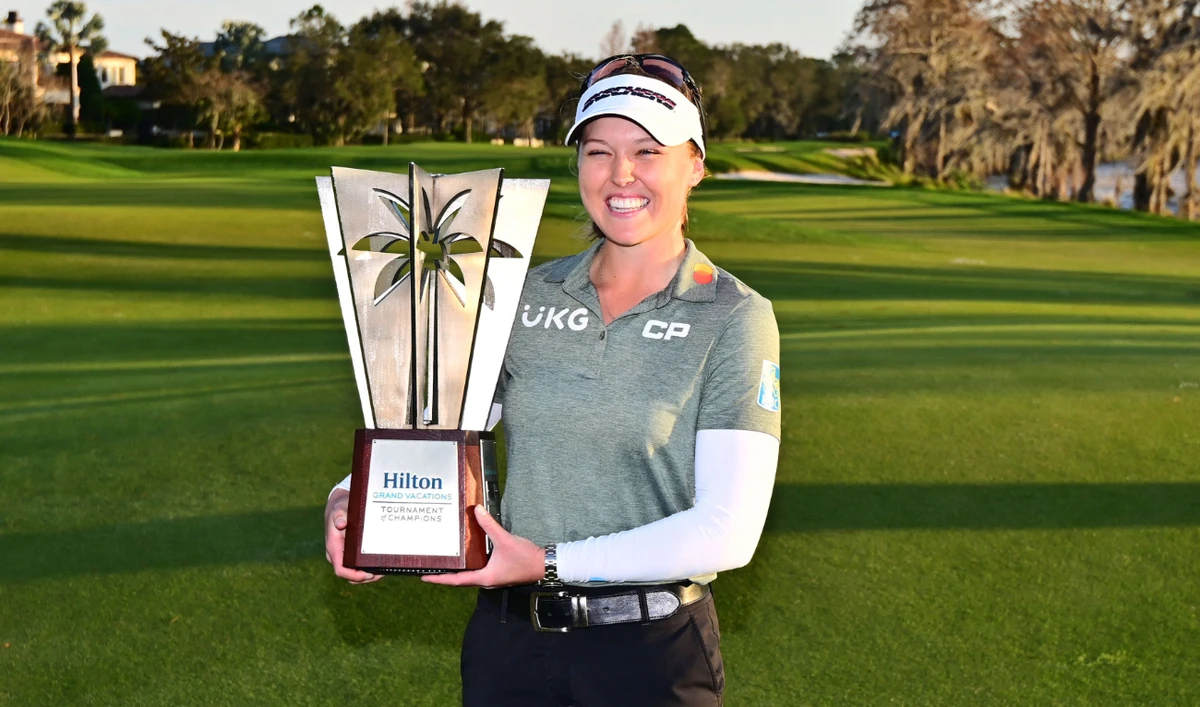Brooke Henderson of Canada with the trophy after winning the Hilton Grand Vacations Tournament of Champions at Lake Nona Golf & Country Club on Sunday in Orlando, Florida. (AFP)