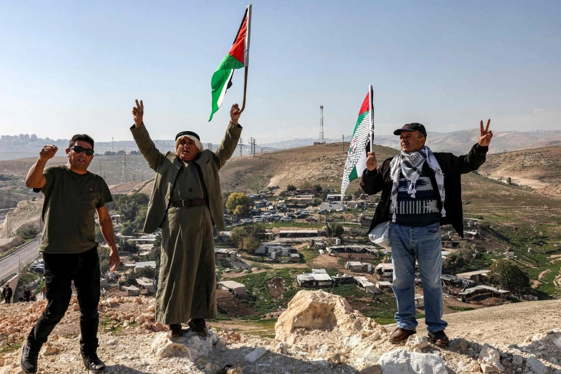 Palestinians demonstrate against the evacuation of Bedouins in the village of Khan al-Ahmar in the occupied West Bank, near the east Jerusalem suburb of Abu Dis on January 23, 2023. (AFP)