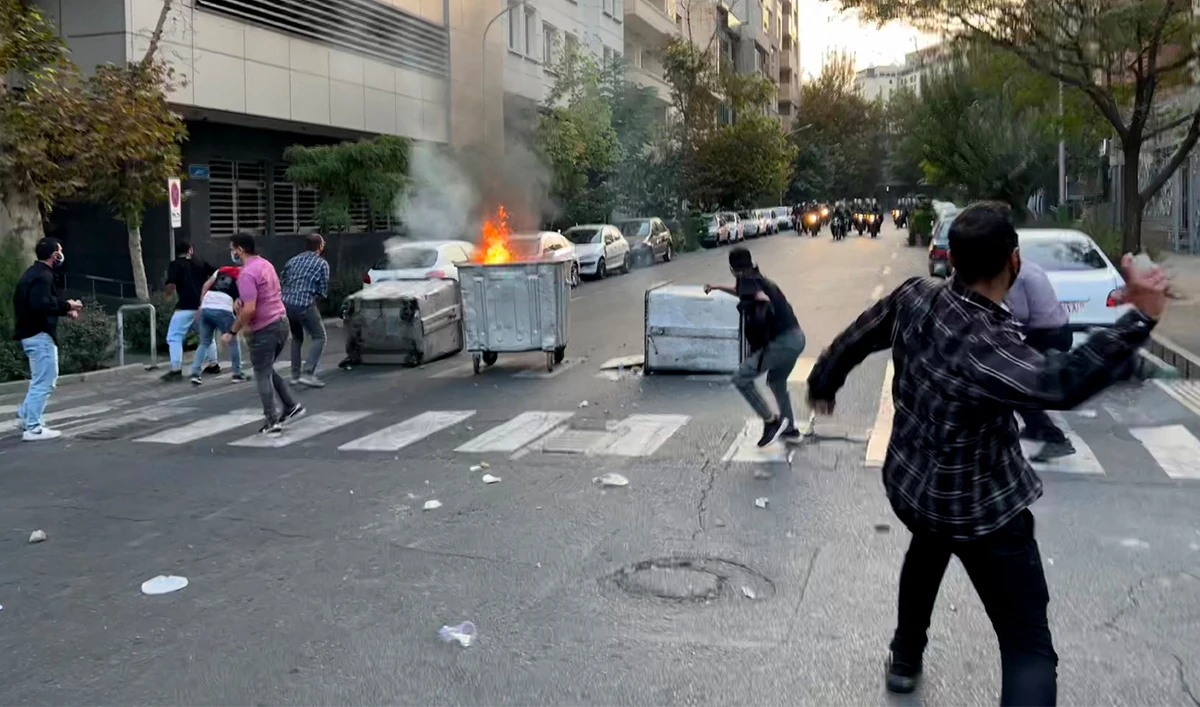A file picture obtained by AFP outside Iran shows a bin burning in the middle of an intersection during a protest for Mahsa Amini, a woman who reportedly died after being arrested by the Islamic republic's "morality police", in Tehran on September 20, 2022. (AFP/File)