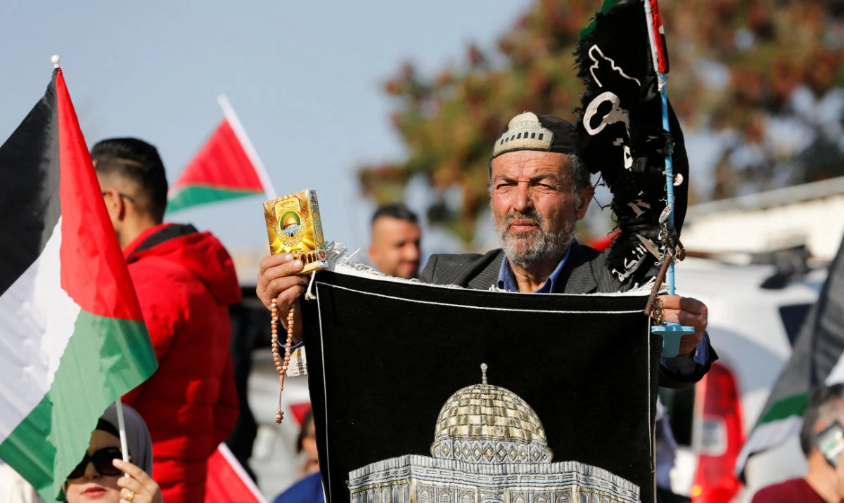 A Palestinian protests in the Bedouin village of Al-Khan Al-Ahmar, which Israel plans to demolish, in the Israeli-occupied West Bank January 23, 2023. (Reuters)