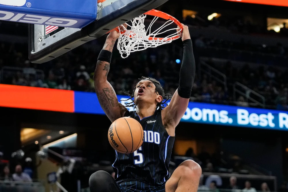 Orlando Magic's Paolo Banchero makes an uncontested dunk against the Boston Celtics during the second half of an NBA basketball game Monday in Orlando, Fla. (AFP)