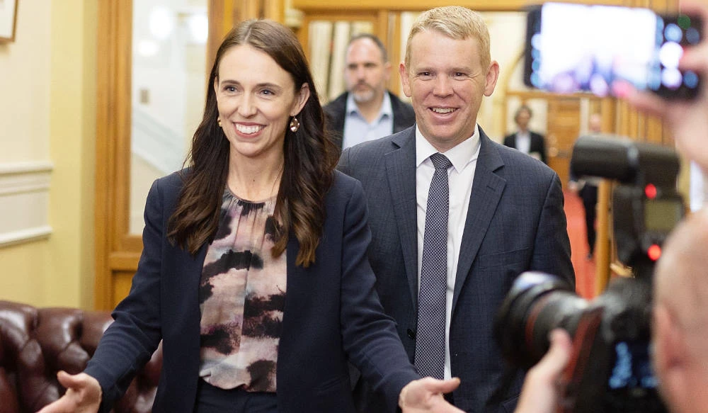 New Zealand Prime Minister Jacinda Ardern (L) and Chris Hipkins arrive at the Labour caucus meeting to elect a new premier at Parliament in Wellington on January 22, 2023. (AFP)