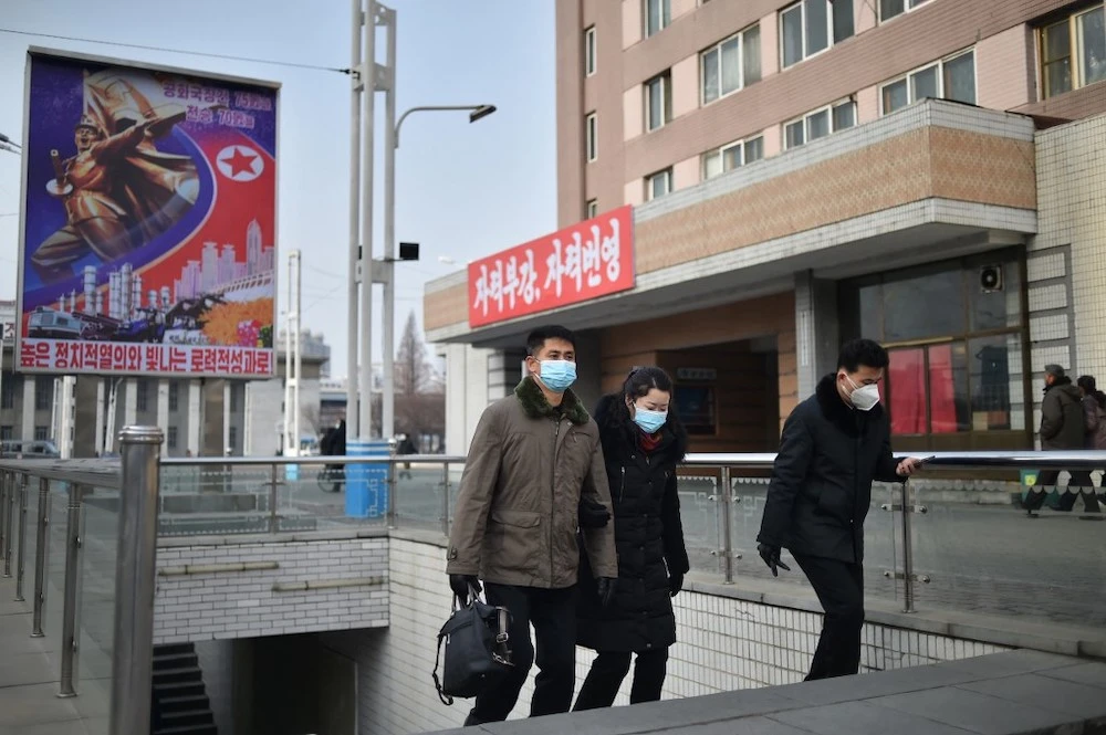 People walk on a street in Pyongyang on January 22, 2023. (AFP)