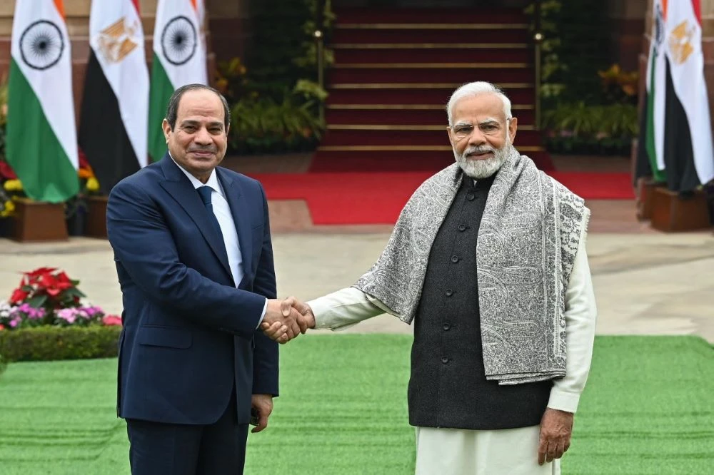 Egyptian President Abdel Fattah El-Sisi shakes hands with Indian Prime Minister Narendra Modi before their meeting at Hyderabad House in New Delhi on Wednesday. (AFP)