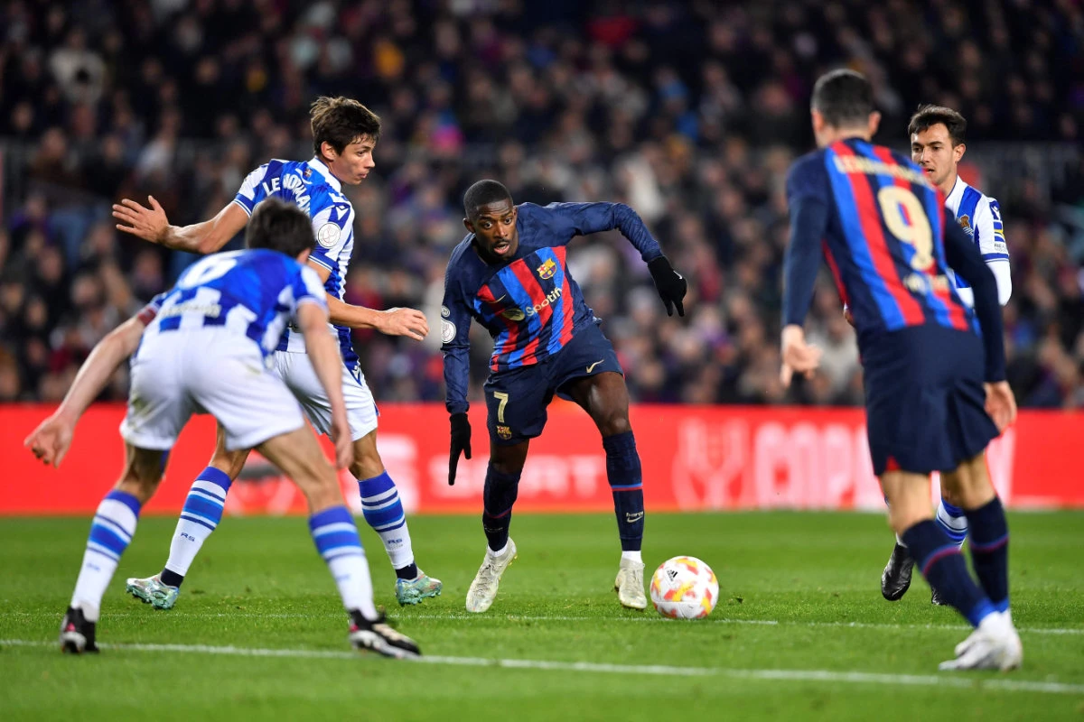 Barcelona's forward Ousmane Dembele (C) controls the ball during their Copa del Rey quarterfinal football match with Real Sociedad at the Camp Nou stadium in Barcelona on Jan. 25, 2023. (AFP)