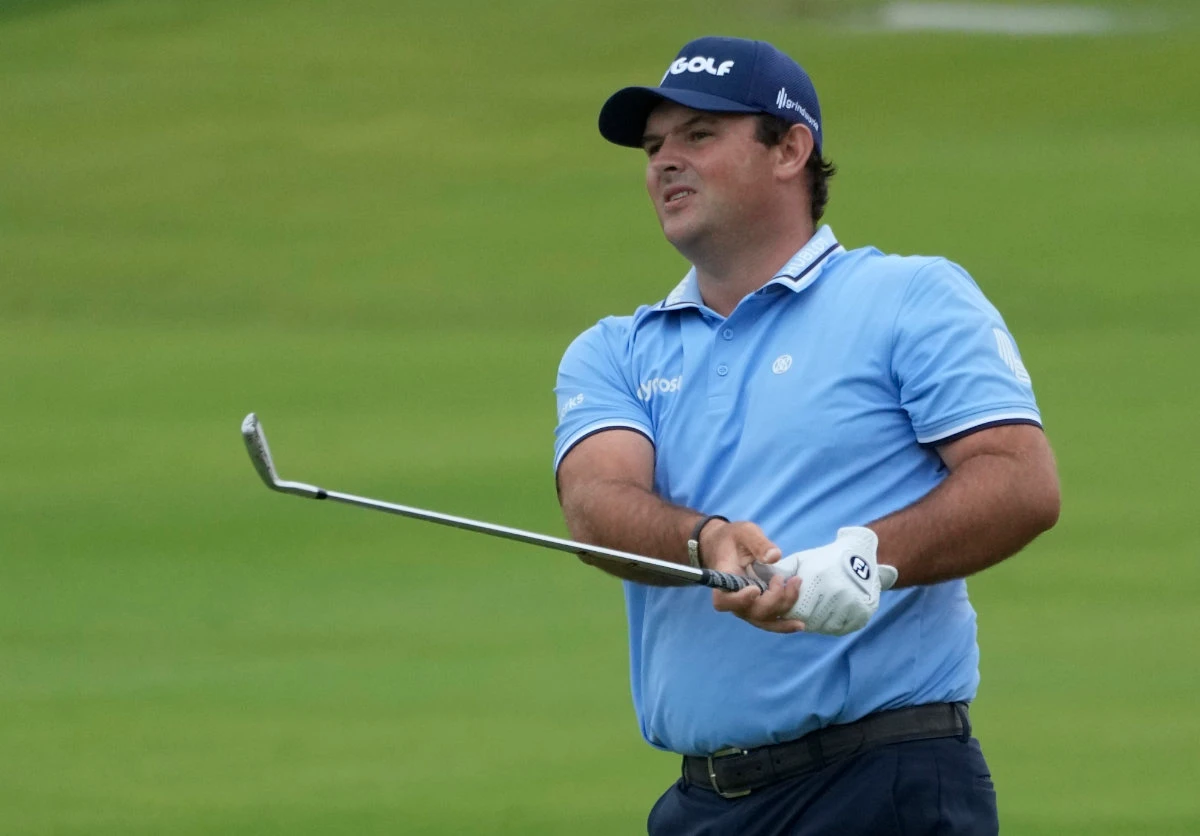 Reed fares better than McIlroy after delayed start in Dubai
