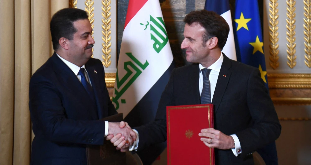 Emmanuel Macron and Mohammed Shia Al-Sudani. (AFP)