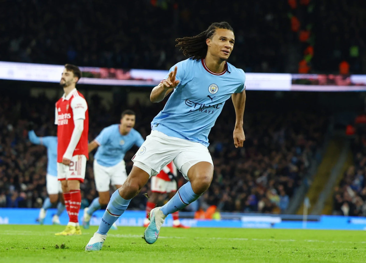 Manchester City's Nathan Ake celebrates scoring their first goal during the FA Cup - fourth round match against Arsenal at Etihad Stadium in Manchester, England on Friday. (Reuters)