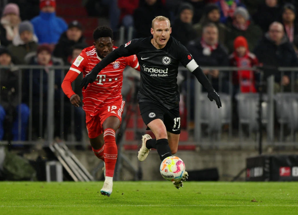 Bayern Munich’s Alphonso Davies in action with Eintracht Frankfurt’s Sebastian Rode during their Bundesliga match at the Allianz Arena, Munich, on Jan. 28, 2023 (Reuters)