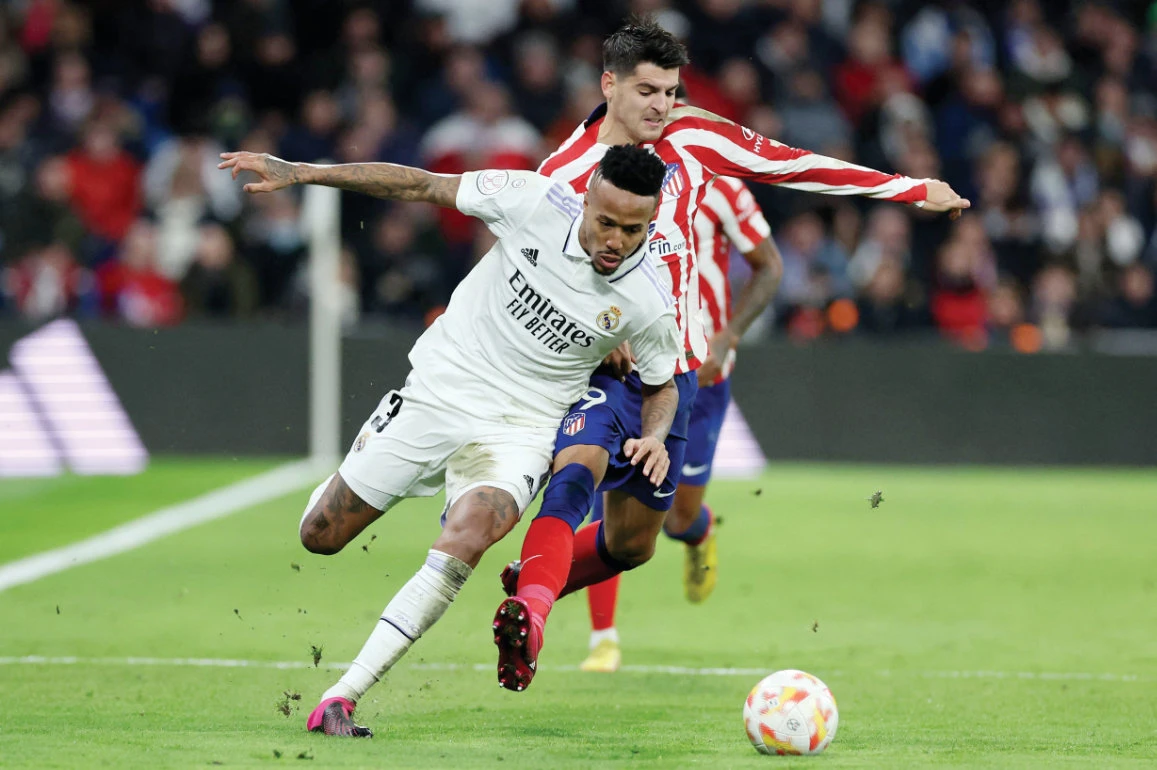 Atletico Madrid’s Spanish forward Alvaro Morata vies with Real Madrid’s Brazilian defender Eder Militao during the King’s Cup quarterfinal match in Madrid. (File/AFP)