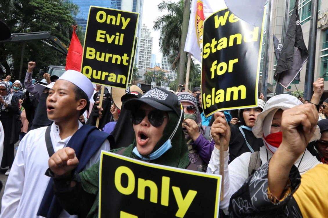 Demonstrators gather outside the Swedish Embassy in Jakarta on January 30, 2023, as they protest against the burning of the Koran in Sweden. (AFP)