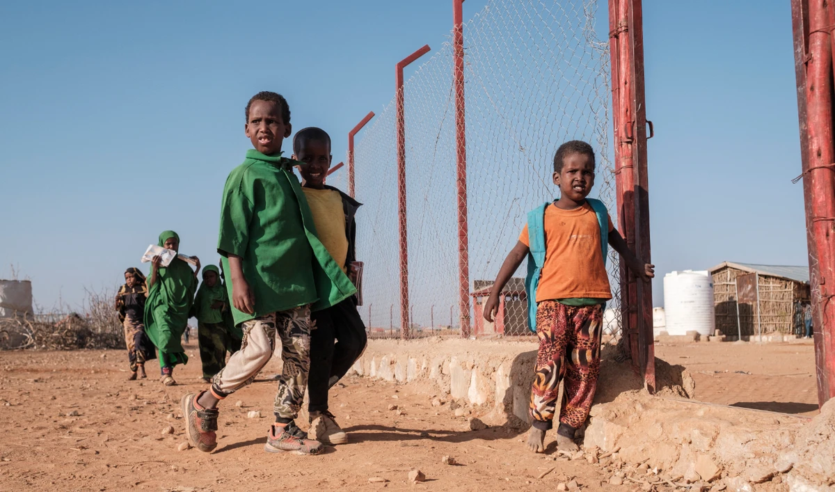 Children walk at a school in the camp for internally displaced people of Farburo in the village of Adlale, near the city of Gode, Ethiopia, on January 11, 2023. (AFP)