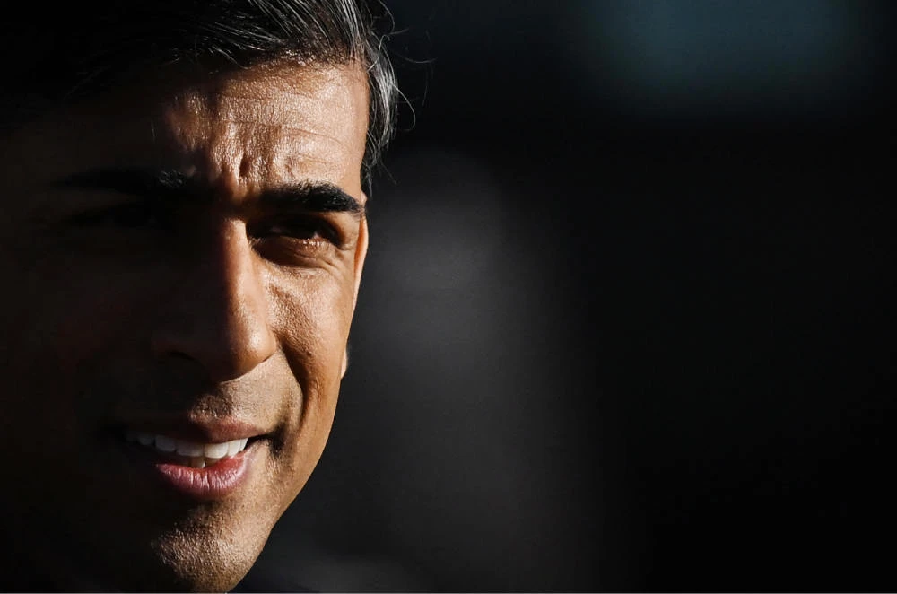 Britain's Prime Minister Rishi Sunak reacts as he leaves Teesside University in Darlington, north-east England, on January 30, 2023 after speaking during a Q&A. (AFP)