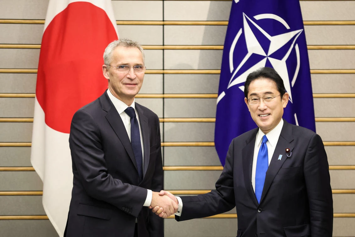 NATO Secretary-General Jens Stoltenberg shakes hands with Japan's Prime Minister Fumio Kishida in Tokyo (REUTERS)