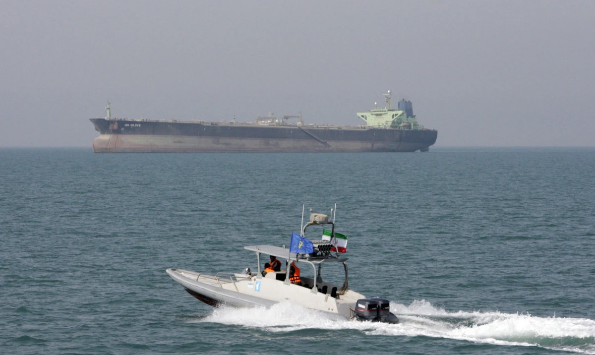 An Islamic Revolutionary Guard Corps speedboat moves in the Persian Gulf near an oil tanker. (AP/File)