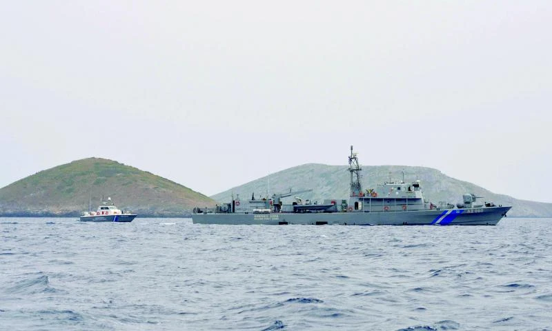 Greek Coast Guard vessels sail next to the Anthropofagos islets, near Fournoi island, in Greece. (Reuters)