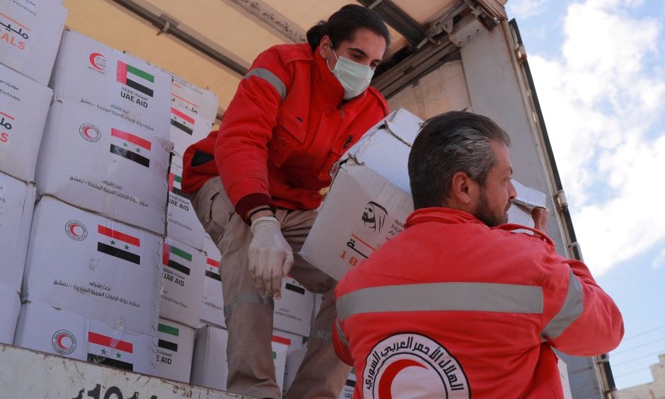 Syrian Arab Red Crescent personnel deliver aid from the UAE, Latakia, Syria, Feb. 15, 2023. (Reuters)