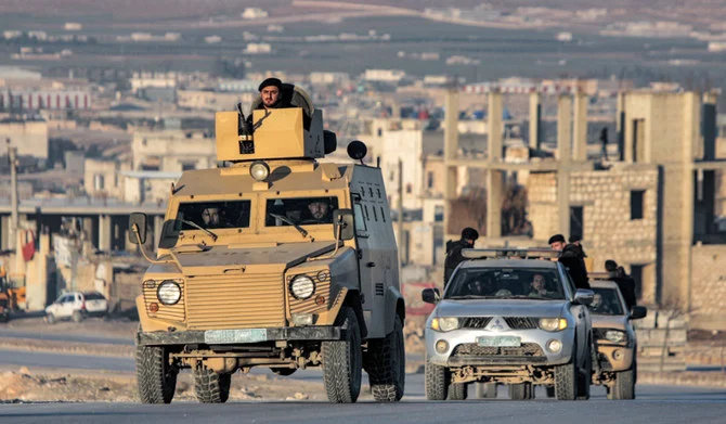Turkey-backed Syrian fighters deploy in vehicles in Al-Bab in the northern rebel-held part of Syria's Aleppo province. (AFP)