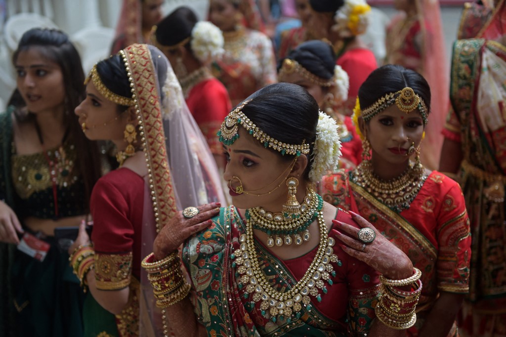 Brides gather as they wait to participate in a mass marriage ceremony in India’s Gujarat state on Dec. 4, 2021. (AFP/File)