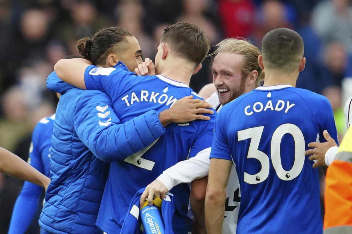 Everton players celebrate their victory at the English Premier League match against Arsenal at Goodison Park in Liverpool, England, on Feb. 4, 2023. (AP)