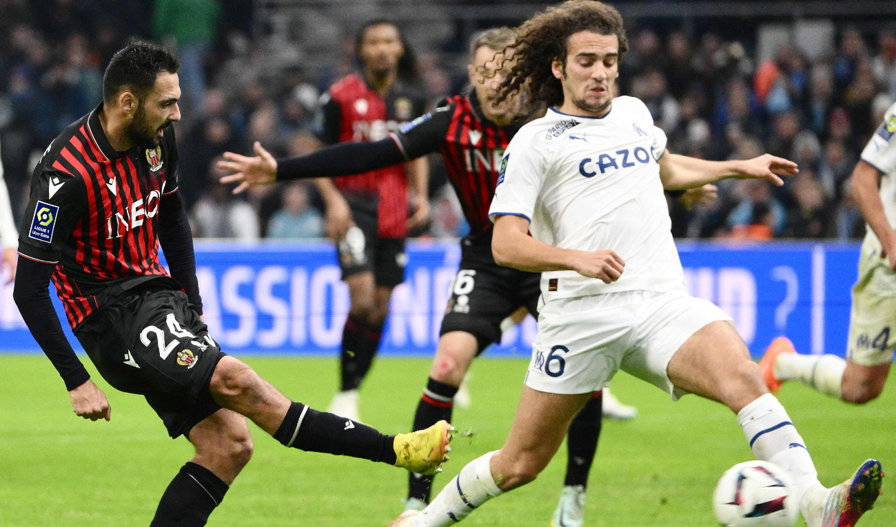 Nice's French forward Gaetan Laborde (L) scores the second goal next to Marseille's French midfielder Matteo Guendouzi during the French L1 football match between Olympique Marseille (OM) and OGC Nice at Stade Velodrome in Marseille on Sunday. (AFP)