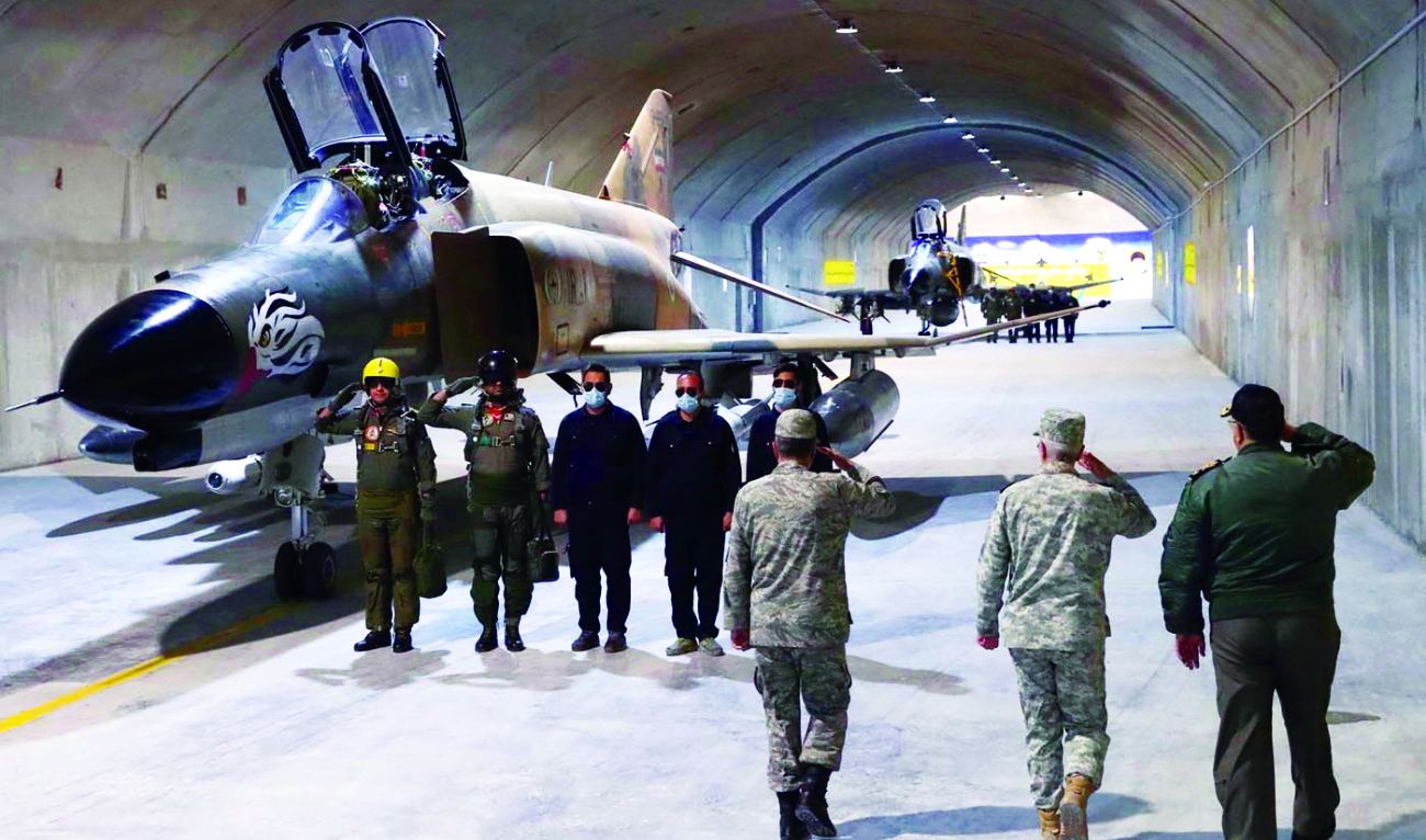 Iranian military officials visit the country’s first underground air force base, called ‘Eagle 44’ at an undisclosed location. (Reuters)