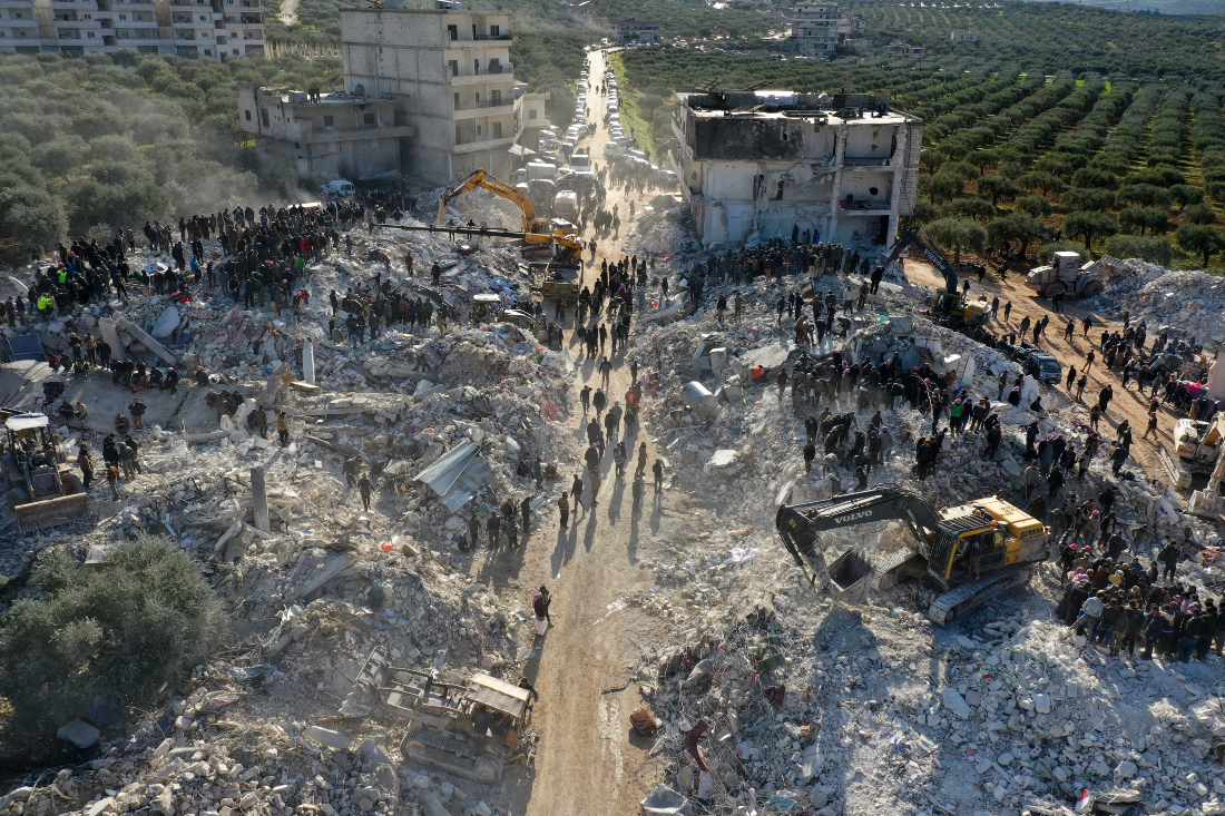 Rescuers searching the rubble of buildings for casualties and survivors in in Syria's rebel-held northwestern Idlib province at the border with Turkiye. (File/AFP)
