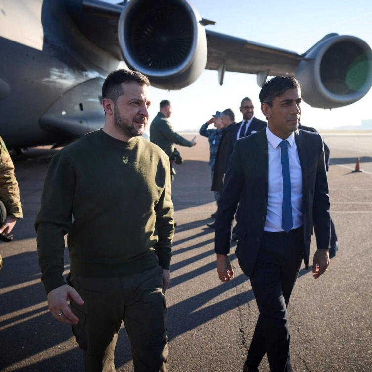 Ukraine's President Volodymyr Zelenskiy walks after arrival with British Prime Minister Rishi Sunak at an airport (REUTERS)
