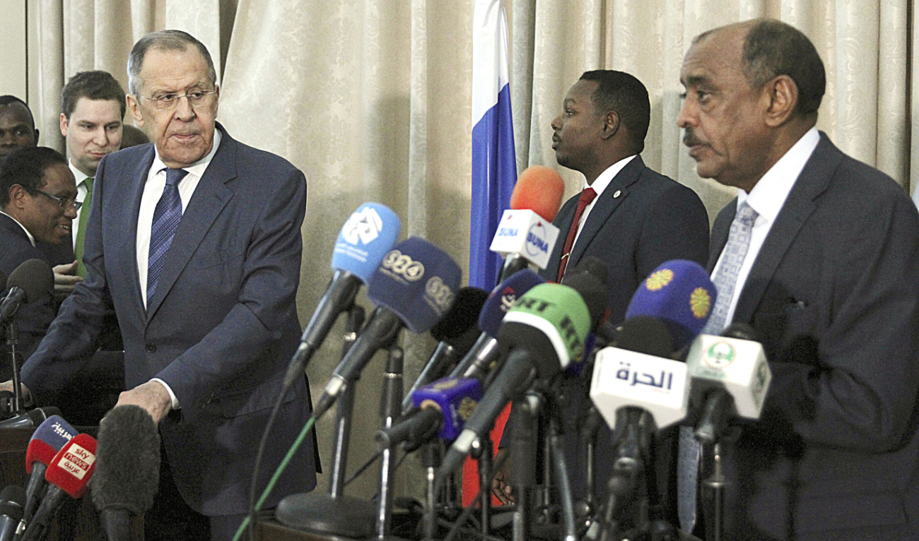 Russian Foreign Minister Sergei Lavrov and Sudanese acting Foreign Minister Ali Al-Sadiq address a press conference at the airport in Khartoum. (AP)