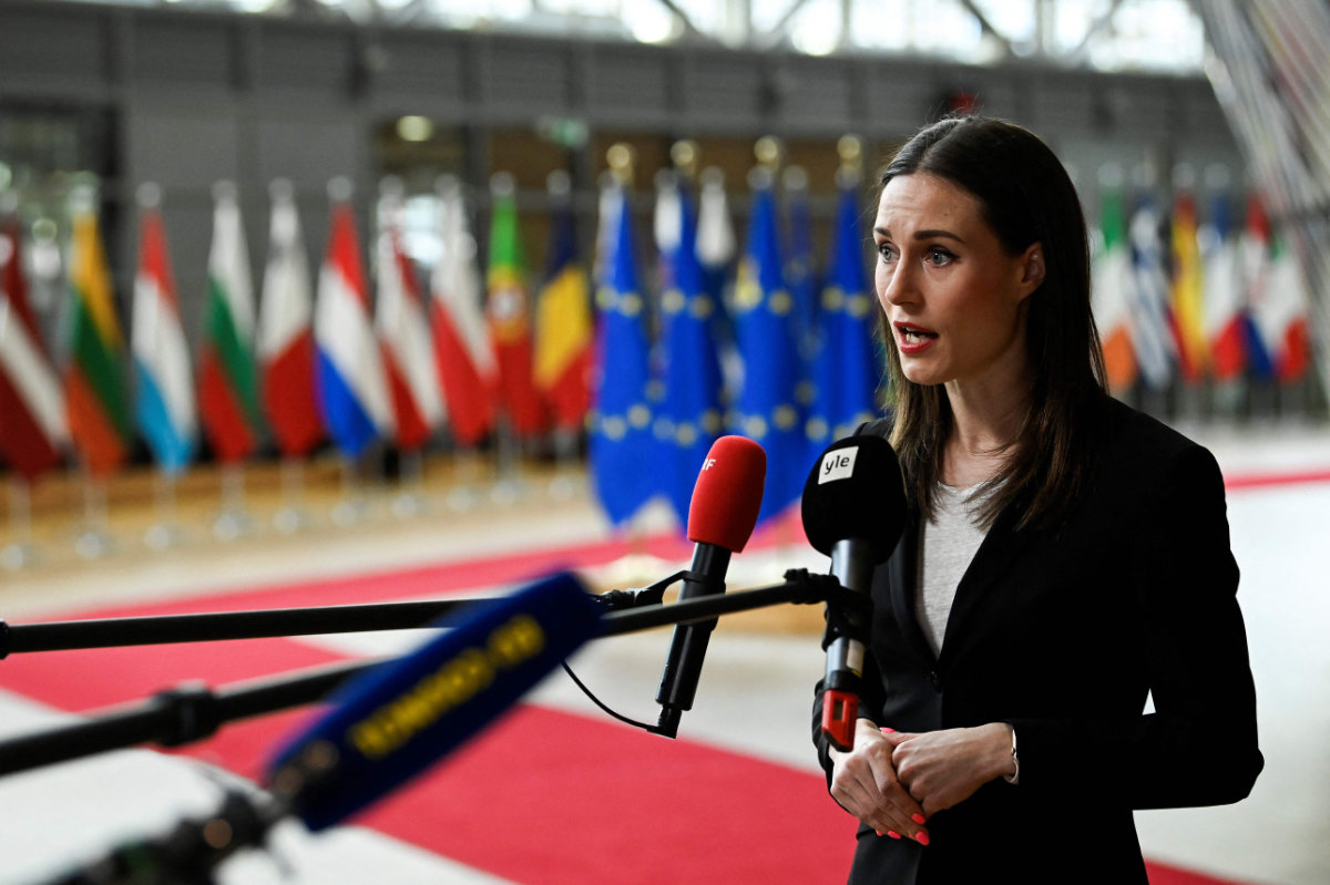 Finland's Prime Minister Sanna Marin faces the media as she arrives for a summit at EU parliament in Brussels on Feb. 9, 2023. (AFP)