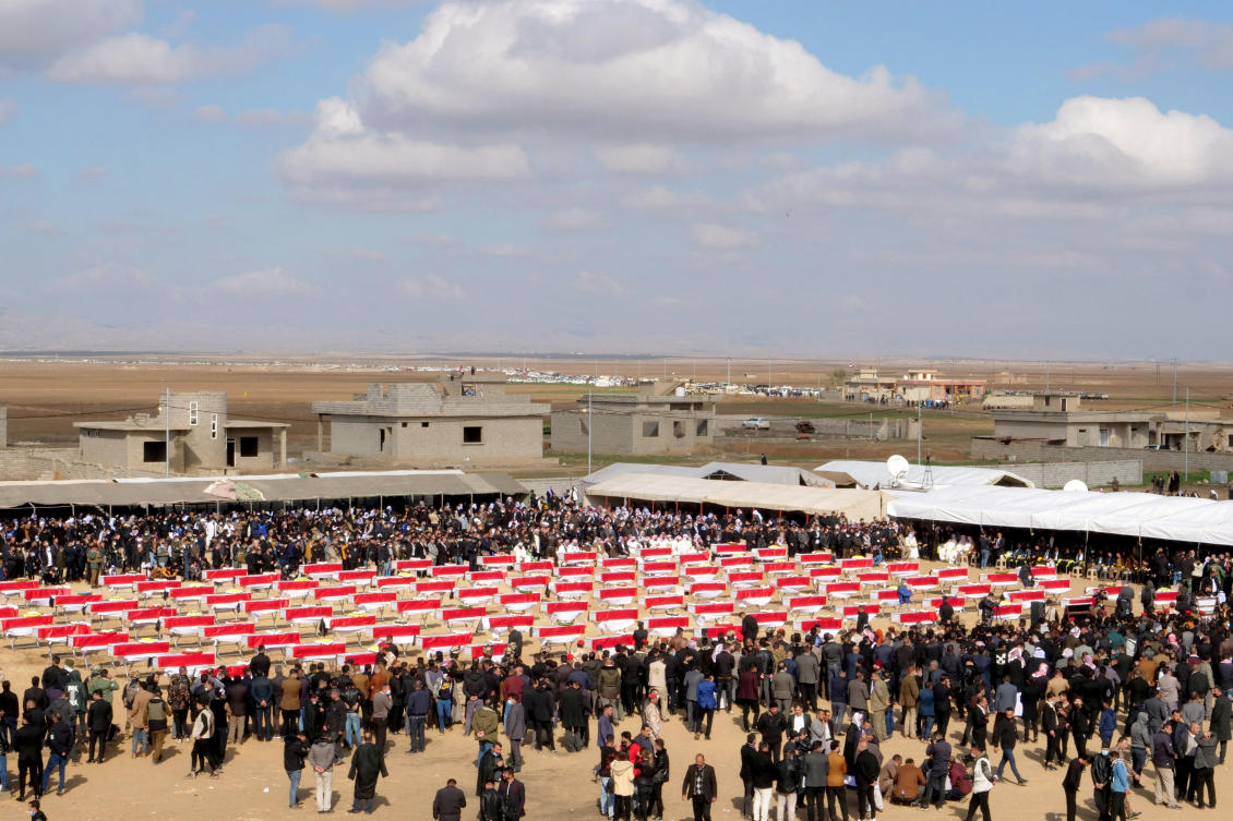 Coffins with remains of Yazidis who were killed by Daesh militants are seen during a funeral in Kojo, Iraq on February 6, 2021. (Reuters/File)