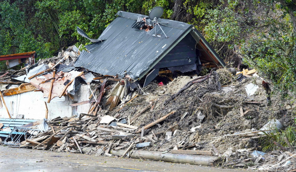 A general view of a damaged house after a storm battered Titirangi, a suburb of New Zealand's West Auckland area, on February 13, 2023. (AFP)