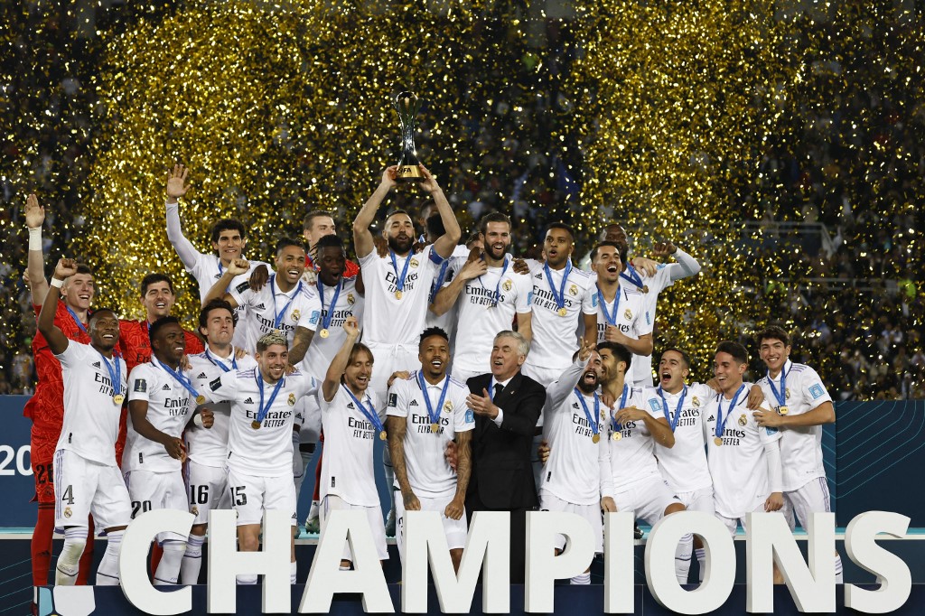 Real Madrid's players celebrate with the trophy at the end of the most recent edition of the FIFA Club World Cup final after defeating Saudi Arabia's Al-Hilal in Rabat. (AFP)