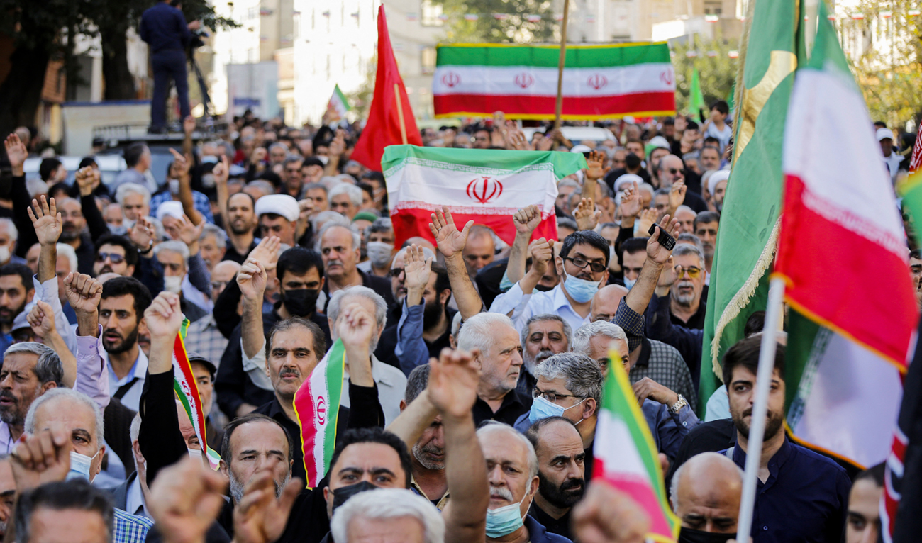 In this file picture taken on October 5, 2022, Iranians take part in a pro-government rally in Tajrish square north of Tehran. (Photo courtesy: AFP/File)