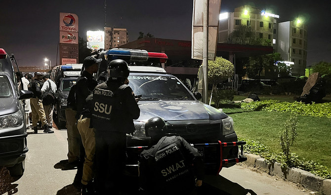 Police officers take position after a police office building was attacked by gunmen in Karachi, Pakistan February 17, 2023. (Reuters)