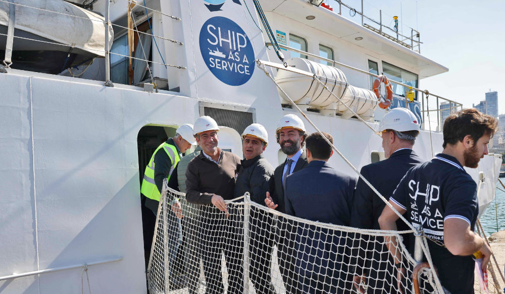 Lebanese caretaker Energy Minister Walid Fayyad (2nd L) and caretaker Minister of Public Works and Environment Ali Hamieh (3rd L), prepare to get onboard maritime research vessel Janus II, on February 17, 2023 at Beirut Port, after it completed environmental scanning operations in Block 9 ahead of the offshore gas exploration activities. (AFP)