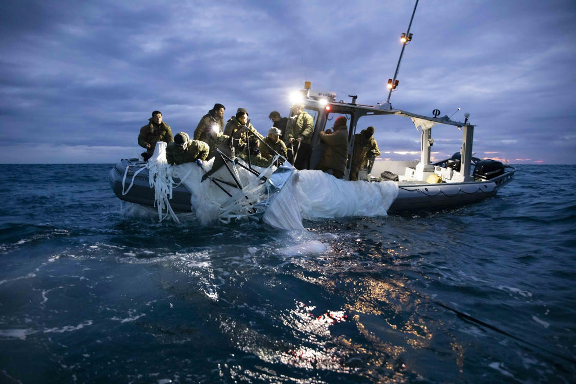 US Navy shows sailors assigned to Explosive Ordnance Disposal Group 2 recover a high-altitude surveillance balloon on Feb. 5, 2023. (US Navy via AP)